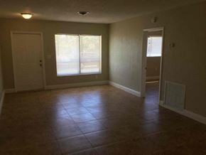 Hollywood house for rent - A room with tile flooring and two windows.