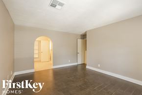 Peoria house for rent - A spacious room with a FirstKey Homes logo.