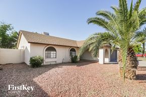 Glendale house for rent - A house with a palm tree in front of it.
