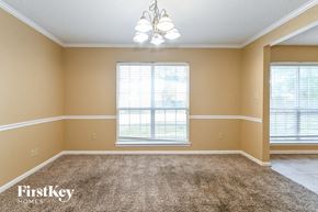 Walls house for rent - a empty living room with a window and a carpet