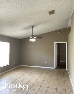 Orlando house for rent - A room with a ceiling fan and a door leading to another room.