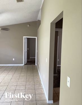 Orlando house for rent - A room with a doorway leading to another room.
