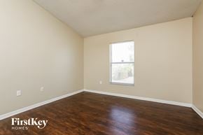 Orlando house for rent - a living room with wood floors and a window