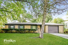 Indianapolis house for rent - a house with a tree in front of it