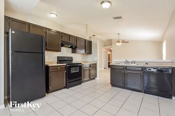 Orlando house for rent - the kitchen is clean and ready to use with stainless steel appliances and black appliances