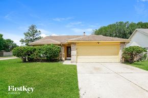 Houston house for rent - A house with a garage door is for sale by FirstKey Homes.