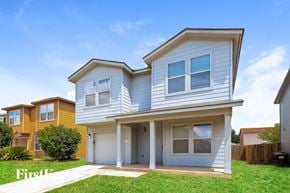 San Antonio house for rent - A two-story house with a garage is shown in the image.