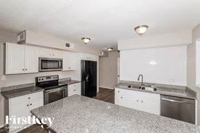 Phoenix house for rent - A kitchen with granite countertops and stainless steel appliances.