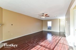 Memphis house for rent - an empty living room with a ceiling fan