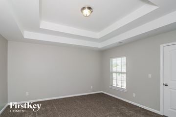 Atlanta house for rent - the living room of a new home with a white ceiling and carpet
