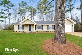 Bessemer house for rent - a home with a large tree in the front yard