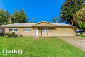Dallas house for rent - a small brick house with a dirt road in front of it