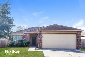 Texas City house for rent - front view of a brick house with a garage door