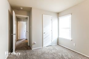 Texas City house for rent - a bedroom with two closets and a door to a hallway