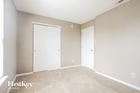 Camby house for rent - a bedroom with two closets and a carpeted floor