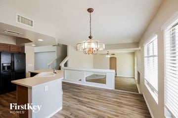 Glendale house for rent - a kitchen and living room with a white counter and a chandelier