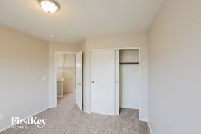 Glendale house for rent - a bedroom with a closet and a toilet and a mirror