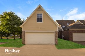 Memphis house for rent - A house with a garage door and a window is shown.