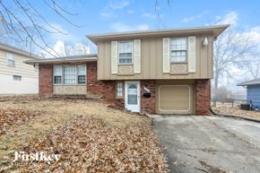 Kansas City house for rent - A two-story house with a garage is for sale.