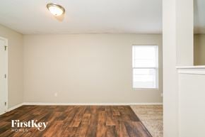 Indianapolis house for rent - A room with wooden flooring and a window letting in natural light.