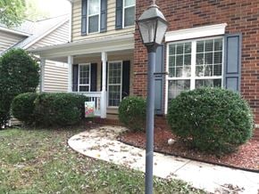 Waxhaw house for rent - a front yard with a lamp post in front of a house