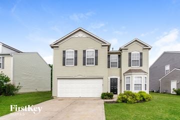 Indianapolis house for rent - a tan house with a white garage door