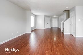 Indianapolis house for rent - the living room and dining room with hardwood flooring