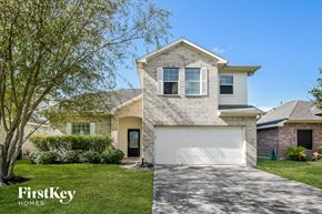 Baytown house for rent - a white brick house with a white garage door
