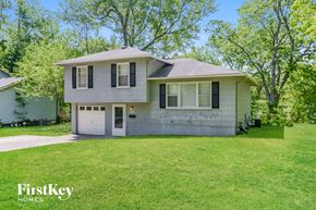 Kansas City house for rent - A two-story house with a garage is for sale.