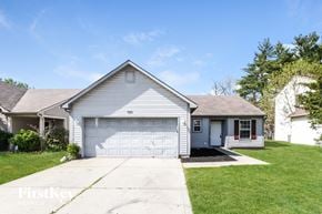 Indianapolis house for rent - a white house with a white garage door