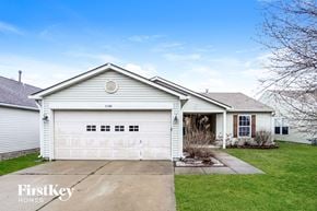 Indianapolis house for rent - A two-car garage is attached to a house.