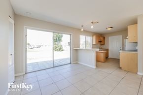 North Port house for rent - a kitchen with a sliding glass door leading to a patio