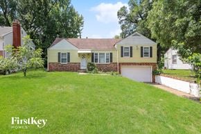 Kansas City house for rent - a home with a lawn and a garage