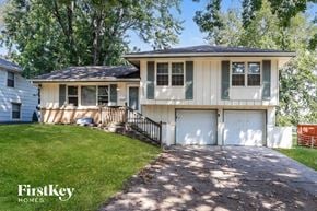 Raytown house for rent - A two-story house with a garage is for sale.
