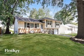 Raytown house for rent - A house with a lawn in front of it.