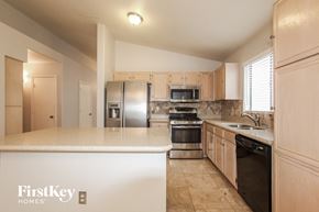 Peoria house for rent - A kitchen with a FirstKey Homes logo on the island.