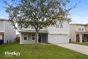 Baytown house for rent - a white house with a tree in the yard