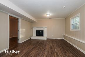 Charlotte house for rent - the living room of an empty house with a fireplace
