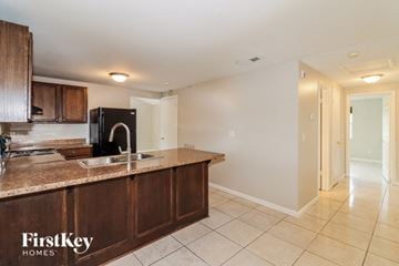 Tampa house for rent - a kitchen with a counter top and a sink
