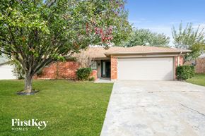 North Richland Hills house for rent - A house with a tree in front of it.