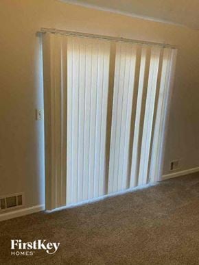 Snellville house for rent - a room with a closet and a sliding door