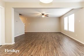 Camby house for rent - A spacious room with wooden flooring and a ceiling fan.