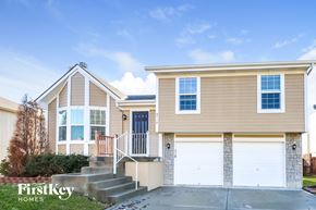 Kansas City house for rent - A two-story house with a garage is for sale.