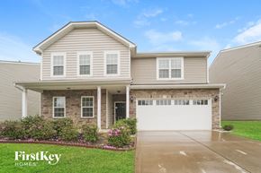 Charlotte house for rent - a house with a white garage door in front of it