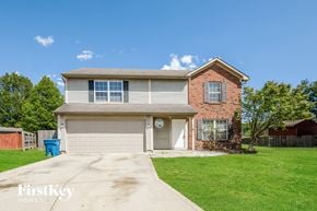 Indianapolis house for rent - a home with a garage and a lawn