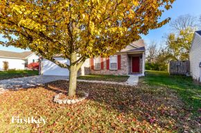 Camby house for rent - a tree in a yard in front of a house