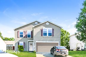 Camby house for rent - a gray house with a car parked in the driveway