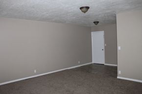 Kansas City house for rent - A room with a white door and carpeted floor.