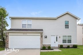 Indianapolis house for rent - a white house with a white garage door