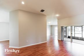 Cutler Bay house for rent - a living room with a hard wood floor and a glass door